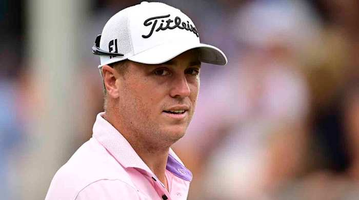 Justin Thomas of the United States reacts on the 18th green during the final round of the 2023 Wyndham Championship at Sedgefield Country Club in Greensboro, North Carolina.